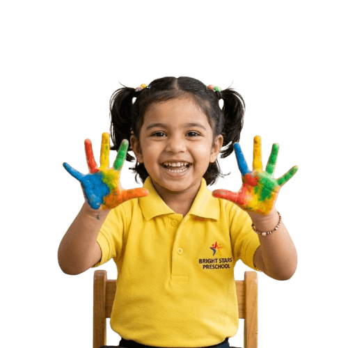 Smiling little girl showing colorful painted hands